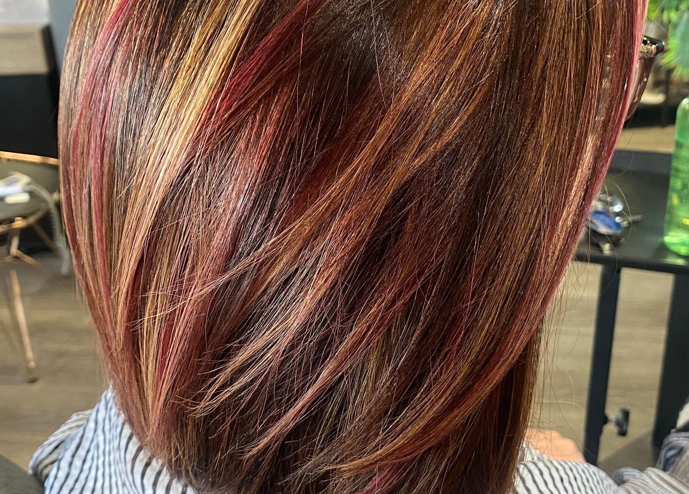 Vibrant hair highlights captured at The Grand Salon, Cahir, County Tipperary, IE, showcasing expert styling.