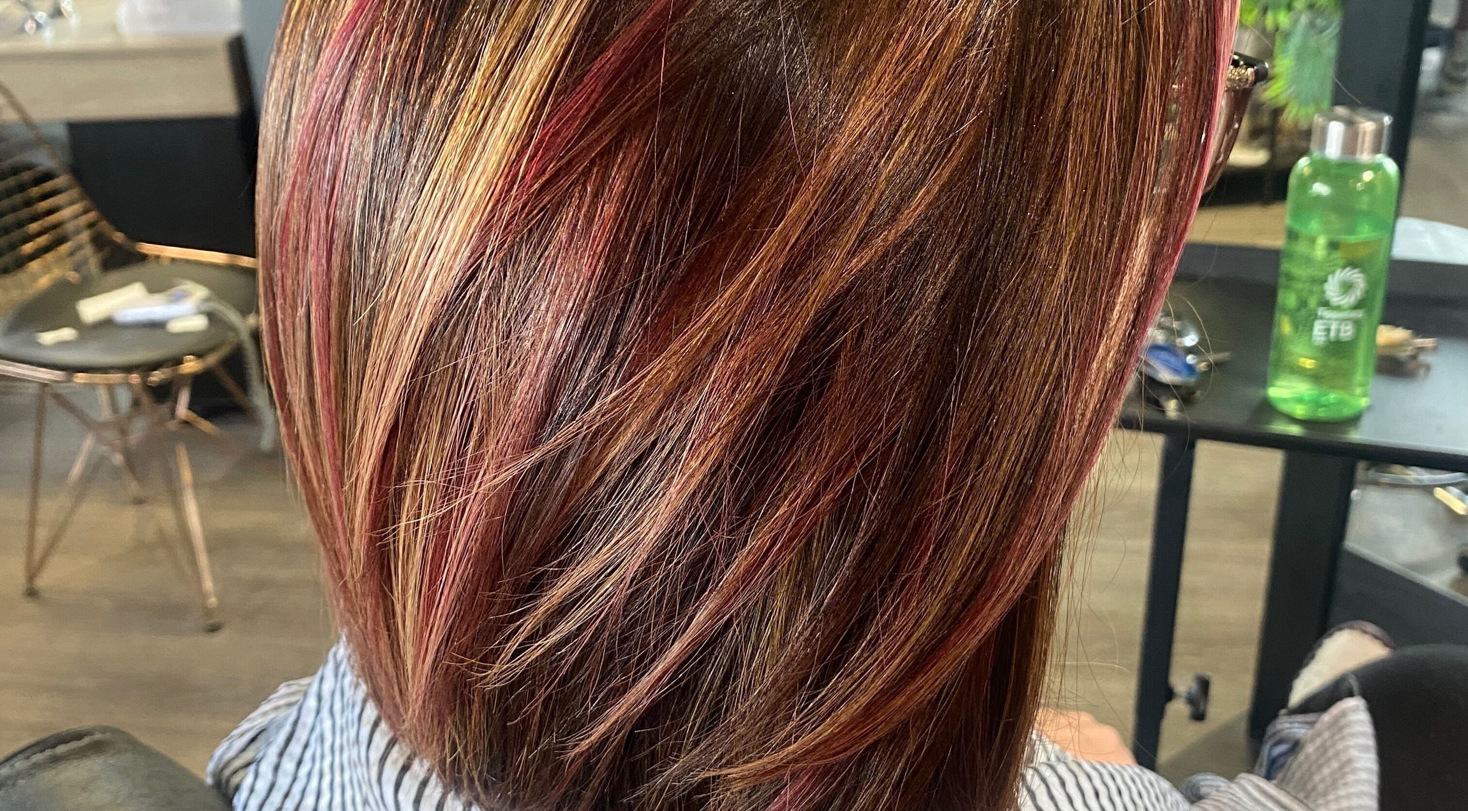 Vibrant hair highlights captured at The Grand Salon, Cahir, County Tipperary, IE, showcasing expert styling.
