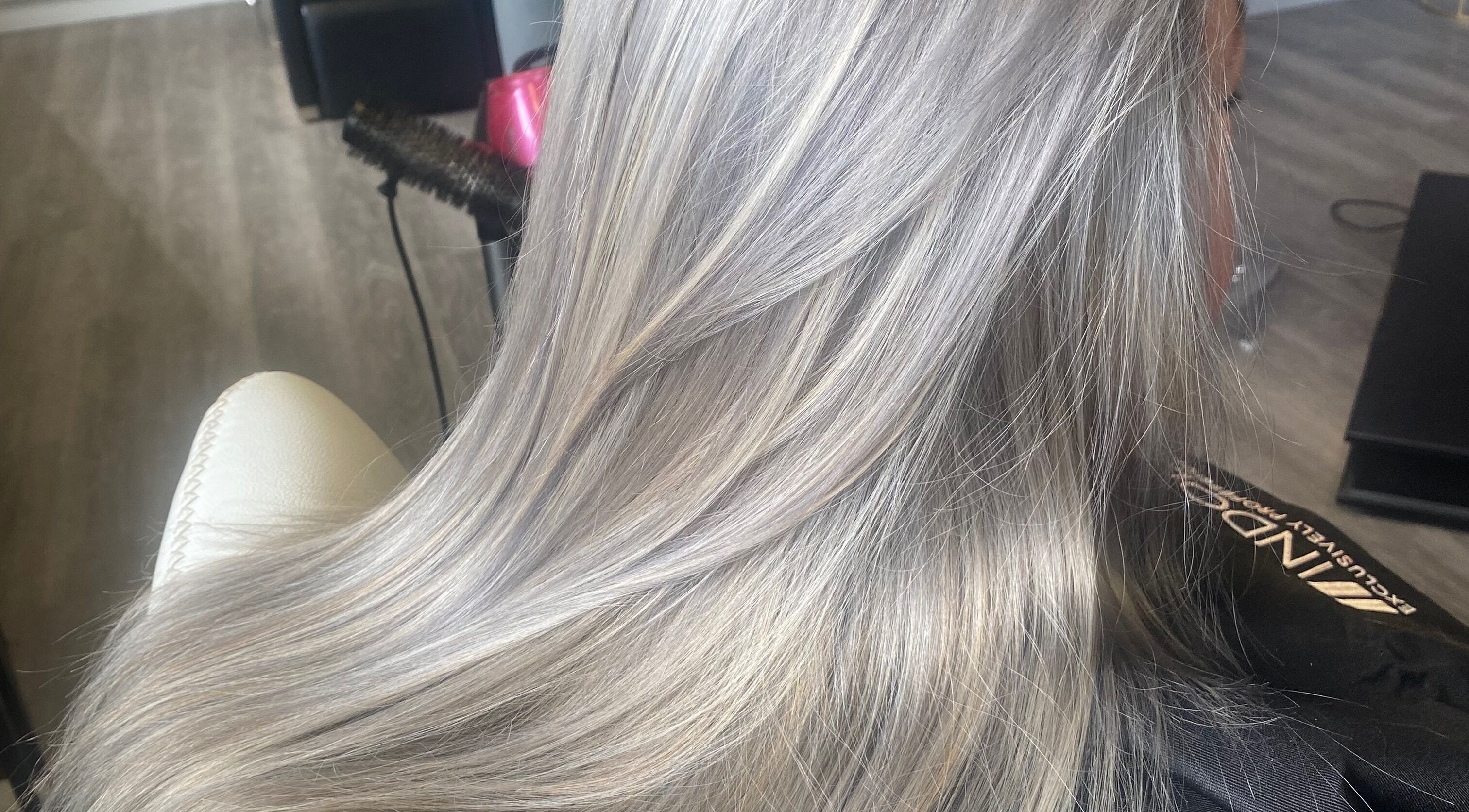 Silky silver hair styled at The Grand Salon, Cahir, County Tipperary, IE, showcasing expert beauty service.