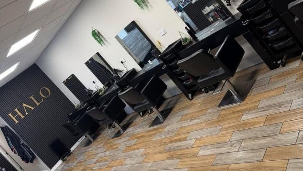 Modern salon chairs and mirrors at Halo Hair & Beauty in Wythenshawe, England, GB.