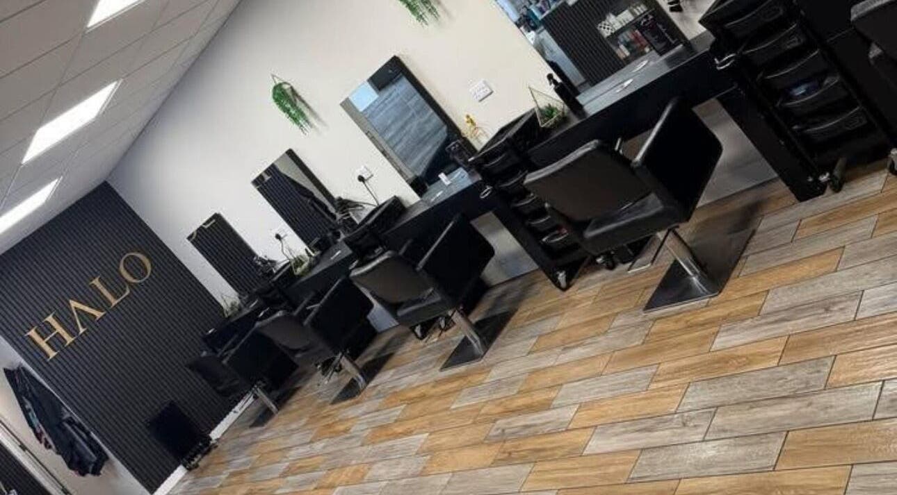 Modern salon chairs and mirrors at Halo Hair & Beauty in Wythenshawe, England, GB.