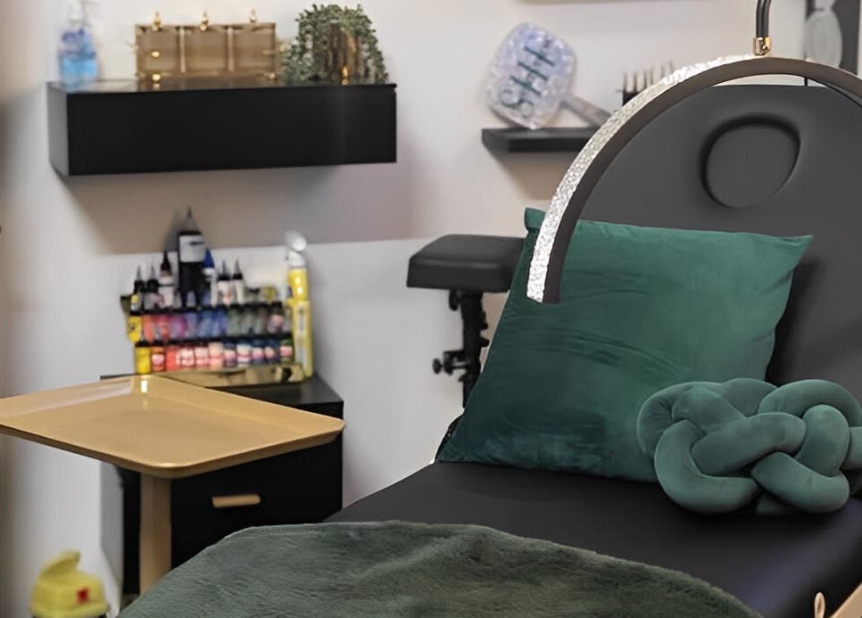Comfortable treatment room at She Studios, London, Ontario, CA, featuring plush decor and modern equipment.
