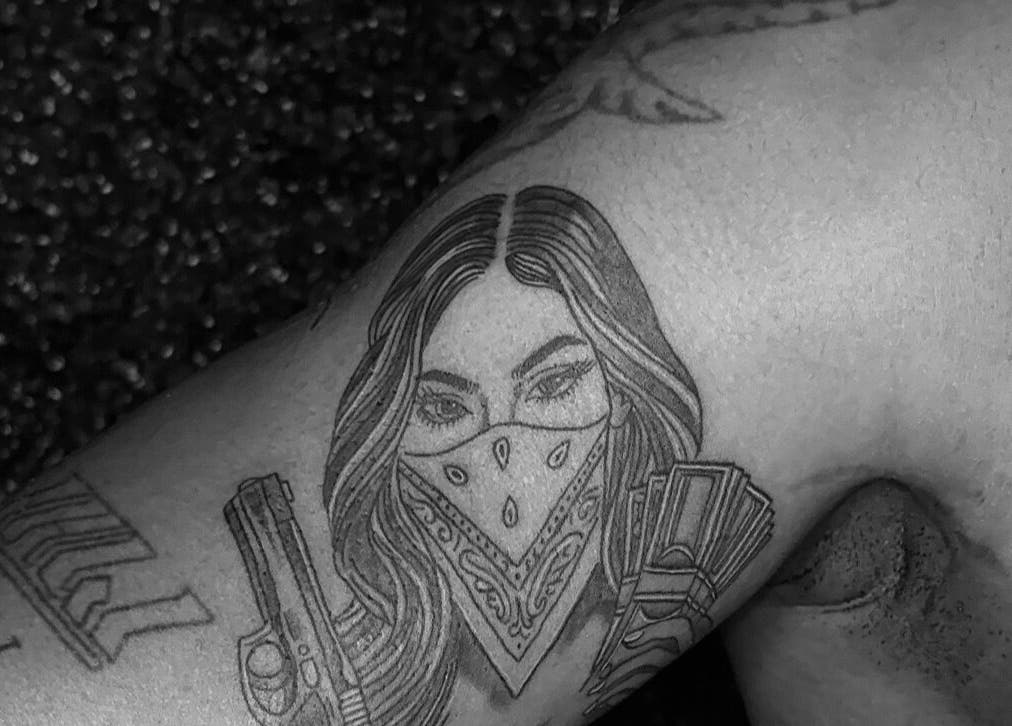 Artistic tattoo on arm at She Studios, London, Ontario, CA, showcasing intricate design details.