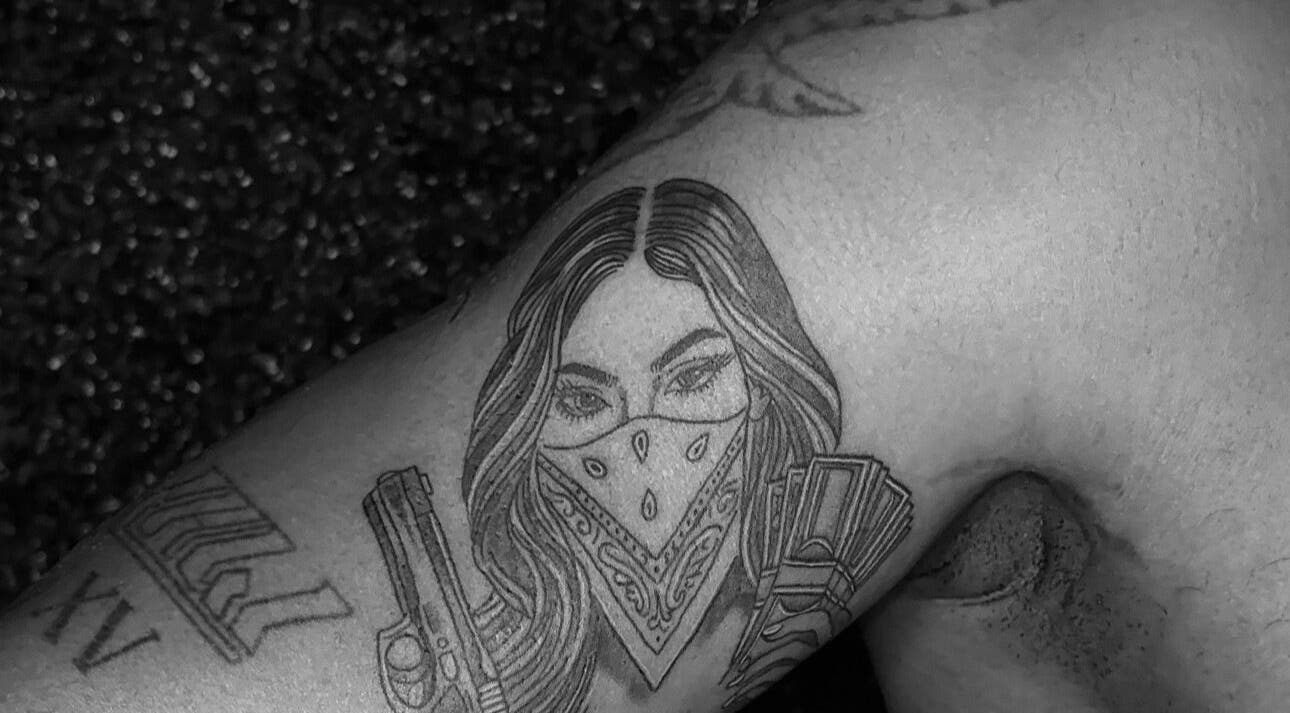 Artistic tattoo on arm at She Studios, London, Ontario, CA, showcasing intricate design details.