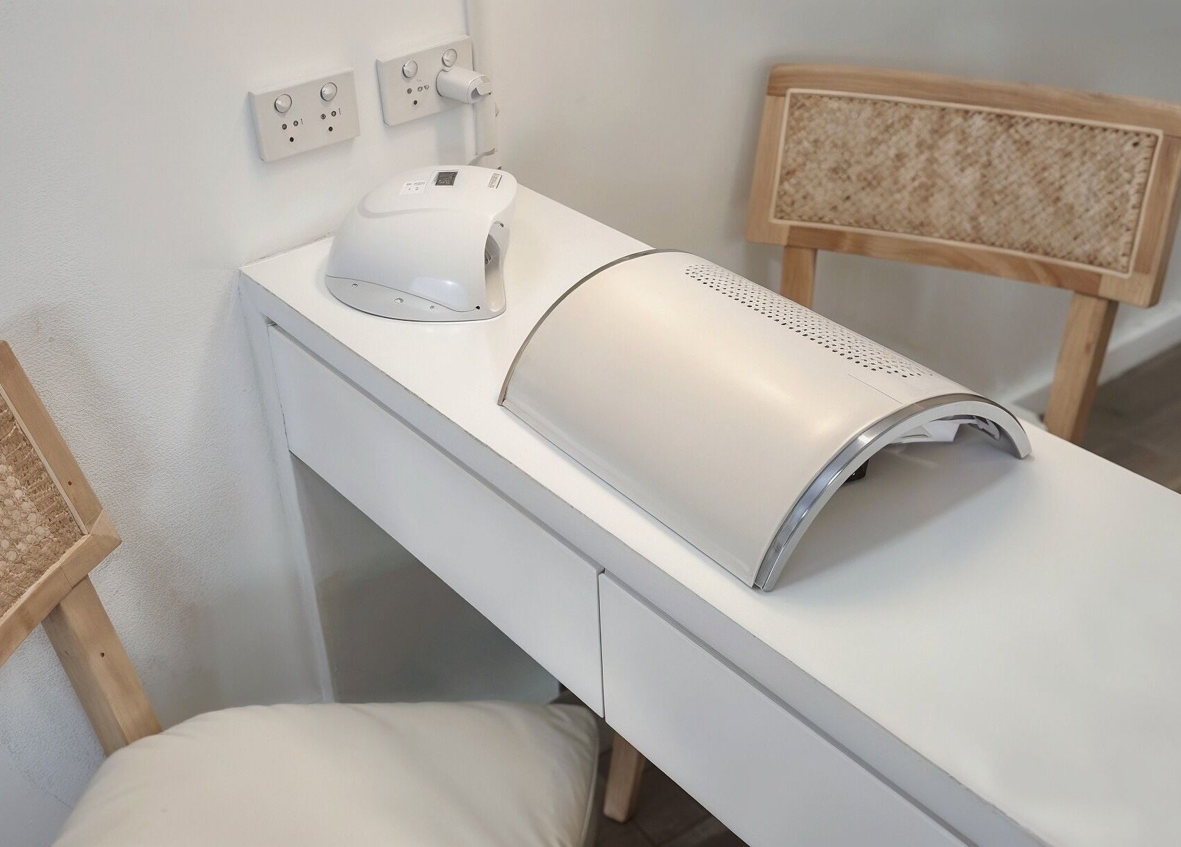 Modern nail workstation at Blush Aesthetics, Avoca Beach, New South Wales, AU, featuring sleek devices and seating.