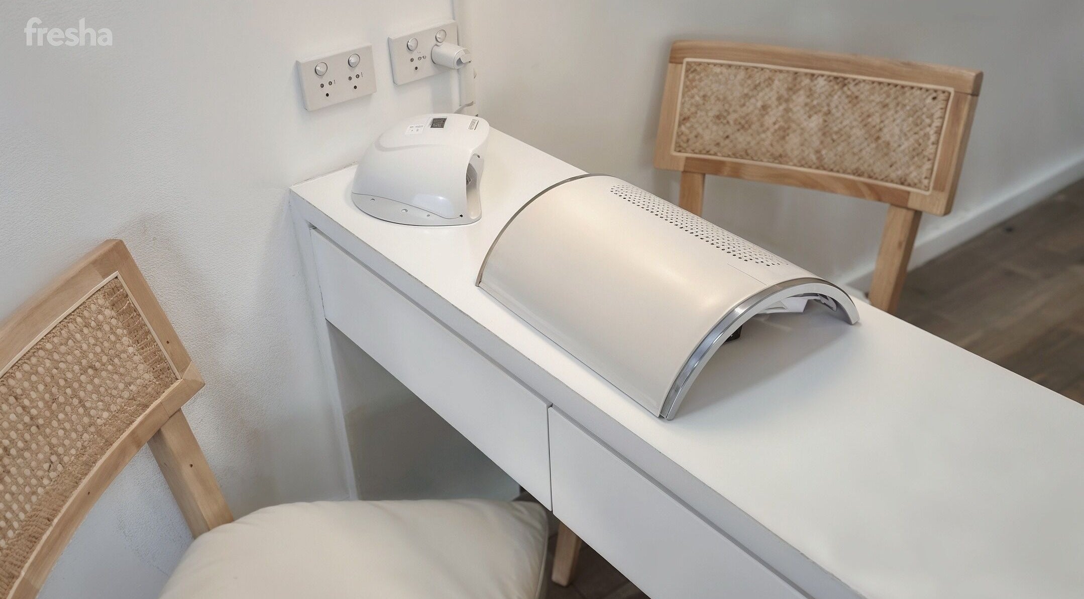 Modern nail workstation at Blush Aesthetics, Avoca Beach, New South Wales, AU, featuring sleek devices and seating.