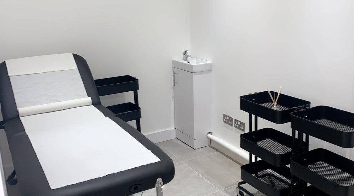 A modern treatment room at Bespoke Brows & Aesthetics, Shirley, England, GB featuring a comfortable therapy bed.