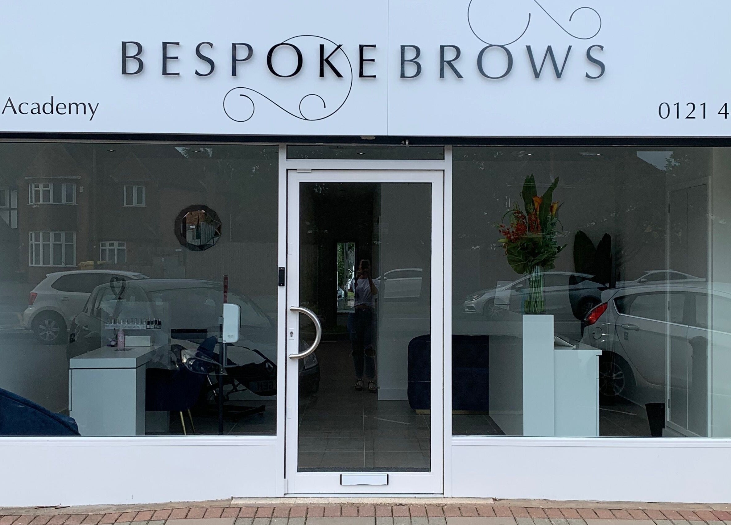 Front view of Bespoke Brows & Aesthetics in Shirley, England, GB, showcasing its modern glass façade.