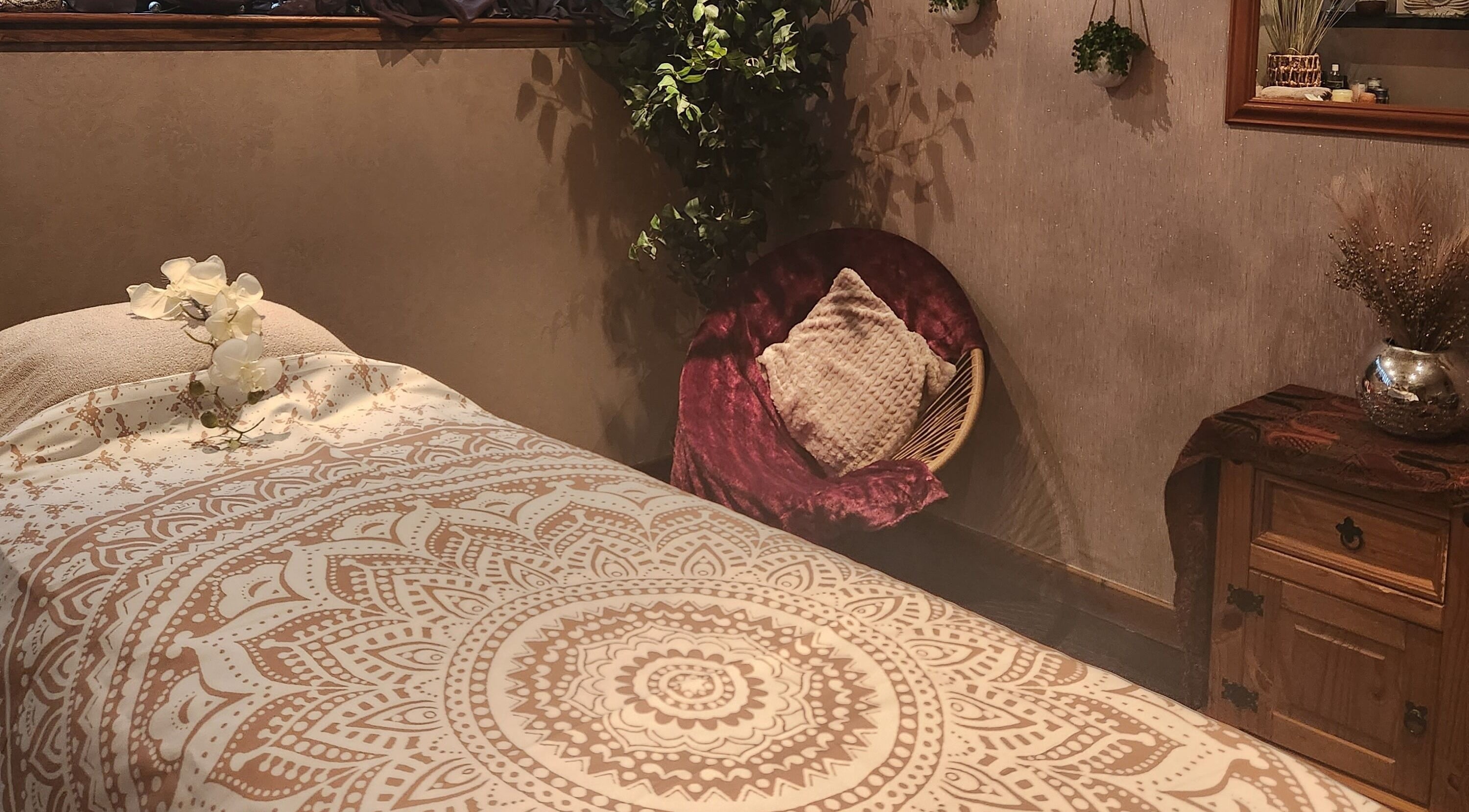 Tranquil massage room at Orchids Spa and Beauty training Ltd, Stourport-on-Severn, England, GB with elegant decor.