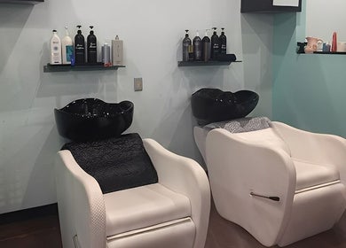 Elegant shampoo station at MaryLuz Hair Salon in Jupiter, Florida, US, showcasing modern hair washing chairs and products.