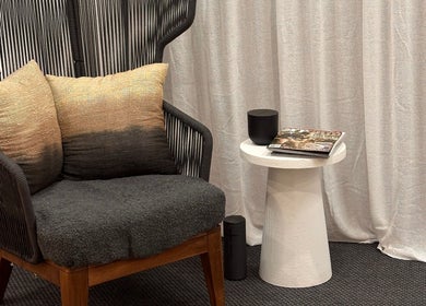 Elegant chair and side table at The Wax Station - North Richmond, New South Wales, AU create a cozy lounge space.