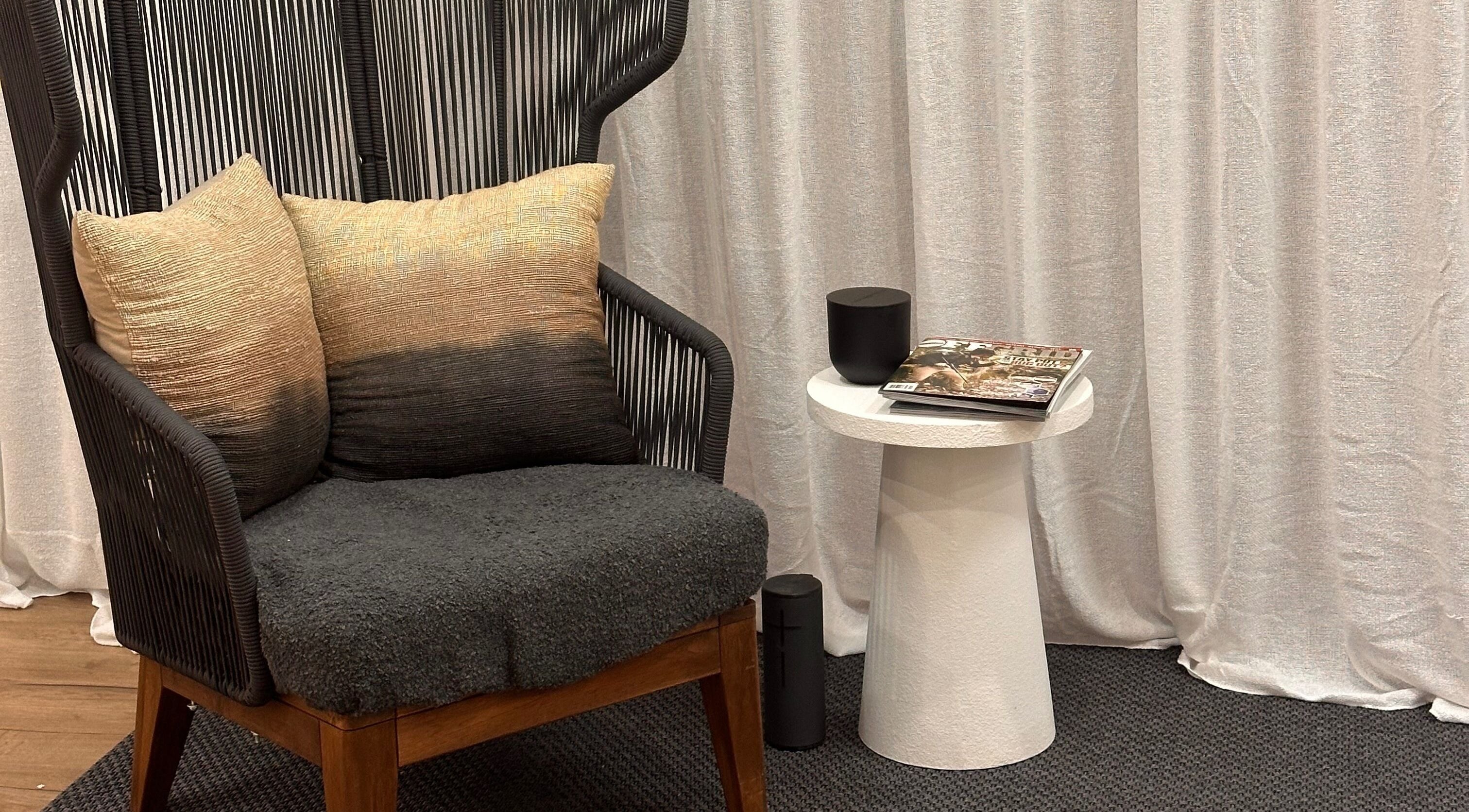 Elegant chair and side table at The Wax Station - North Richmond, New South Wales, AU create a cozy lounge space.