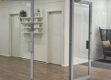 Glass entrance at The Wax Station - North Richmond in New South Wales, AU, showcasing stylish interior decor.