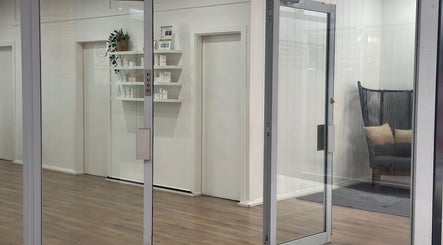 Glass entrance at The Wax Station - North Richmond in New South Wales, AU, showcasing stylish interior decor.