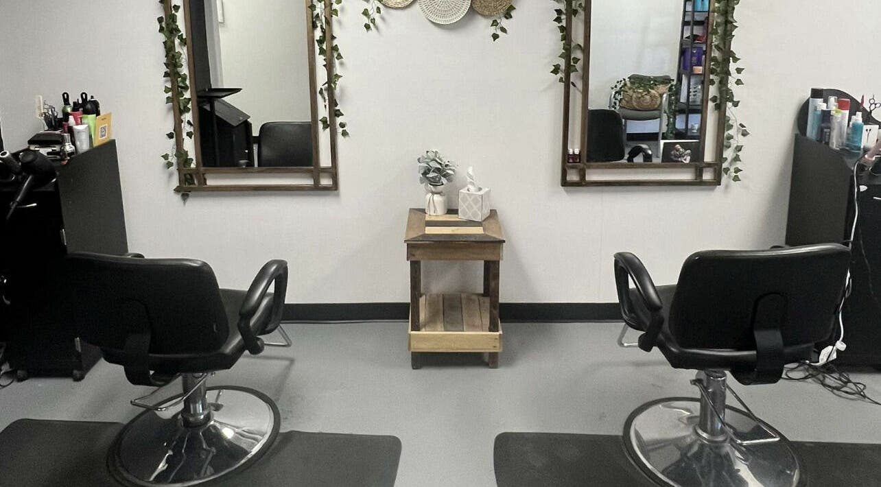 Chic styling station at Dash Beauty Lounge in Alma, Michigan, US. Elegant mirrors and chairs enhance the ambiance.