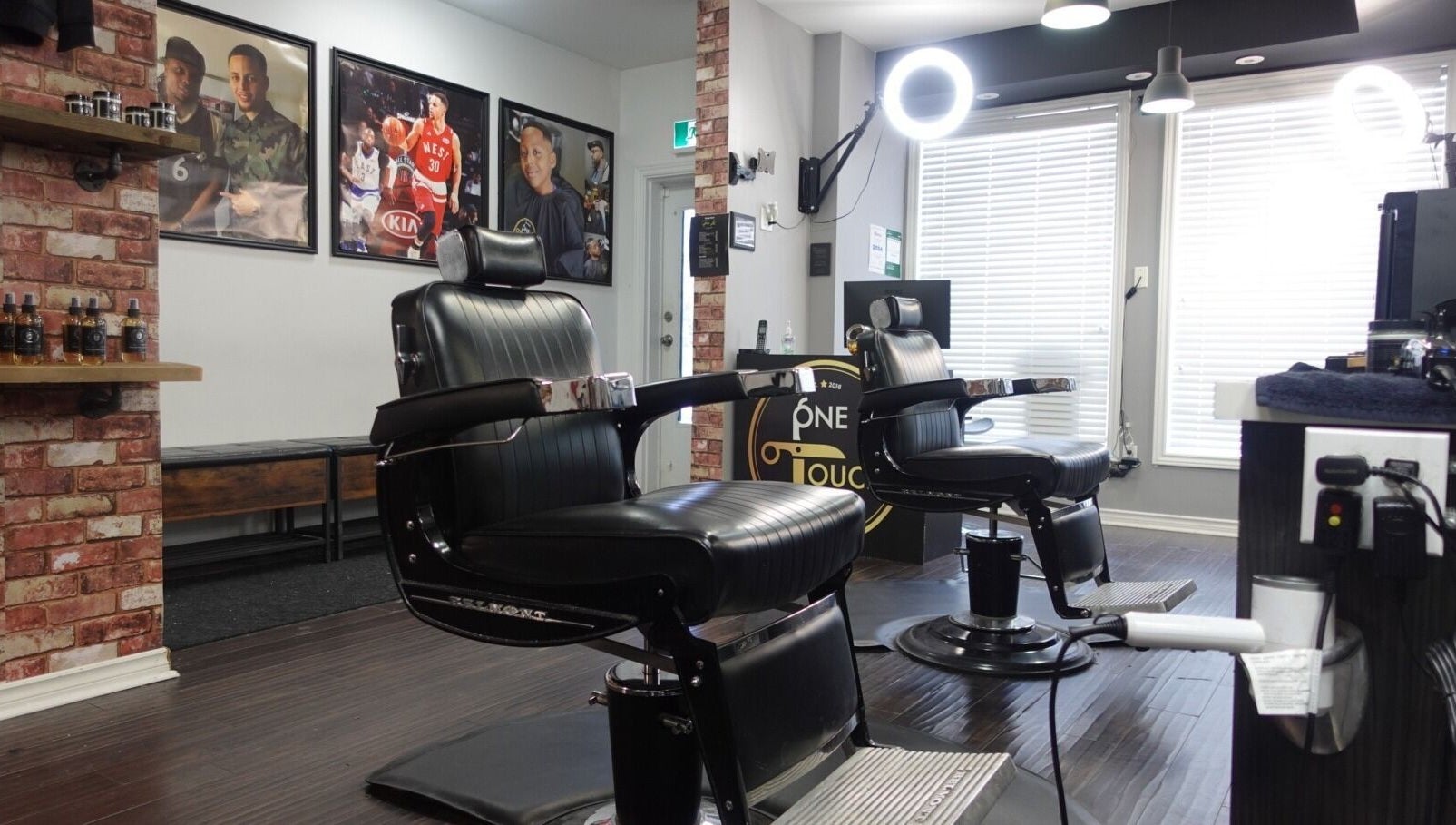 Sleek barber chairs at One Touch Barbers Inc, Markham, Ontario, CA offering premium grooming services.