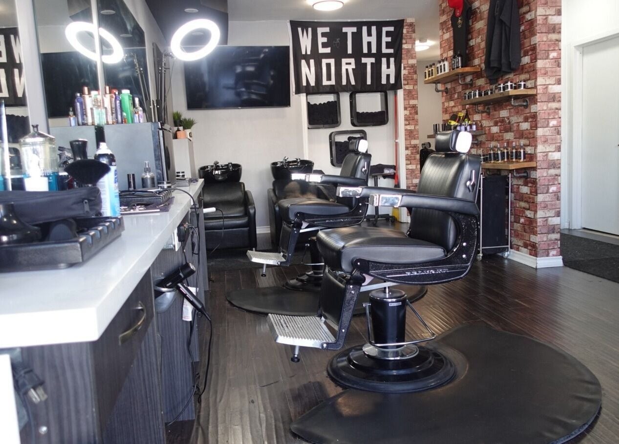 Modern barber chairs at One Touch Barbers Inc, Markham, Ontario, CA. A sleek and stylish grooming space.