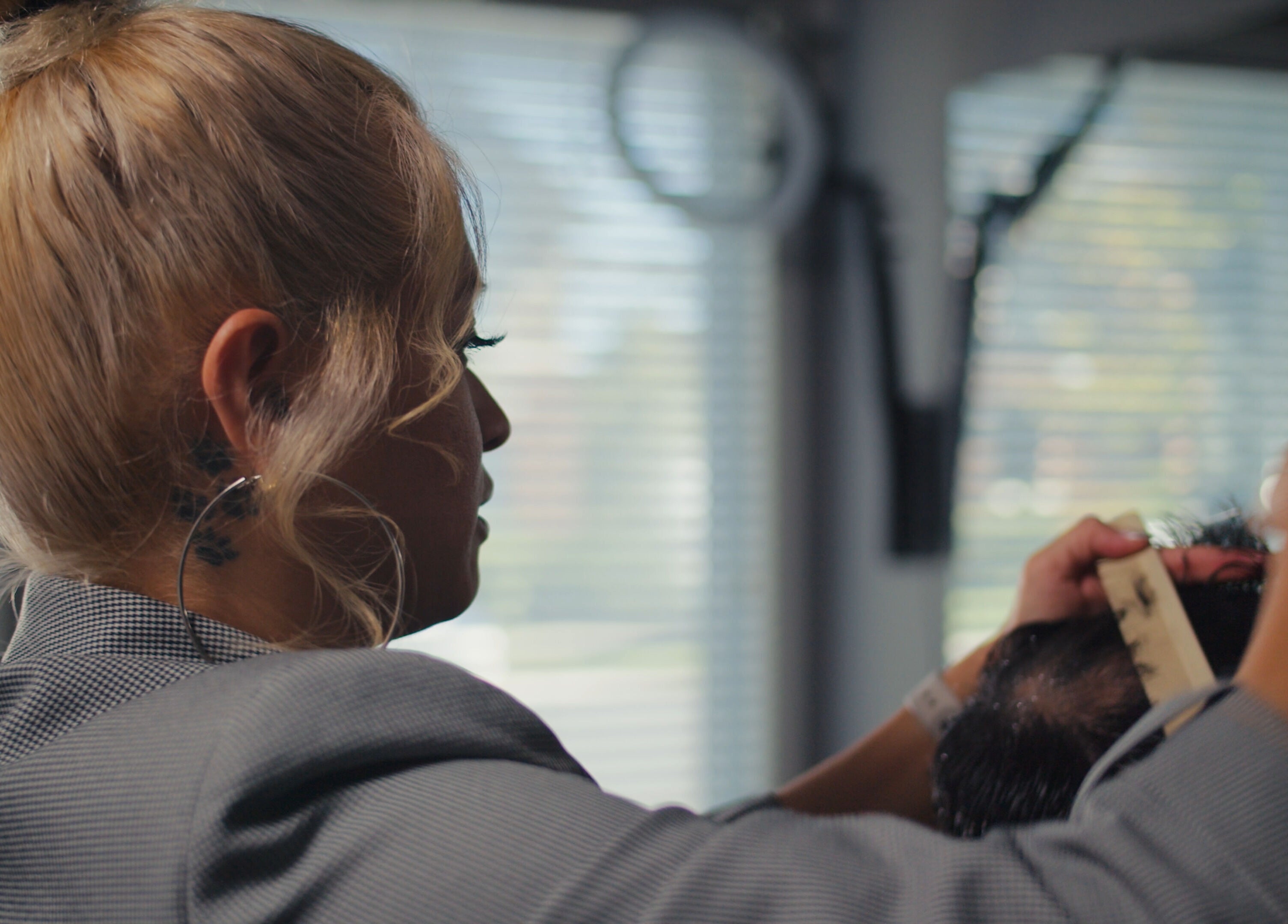 Professional stylist at One Touch Barbers Inc in Markham, Ontario, CA, expertly styling a client's hair.