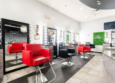 Modern salon interior at Hair in Motion of New York - MetroWest, Orlando, Florida, US with stylish decor.