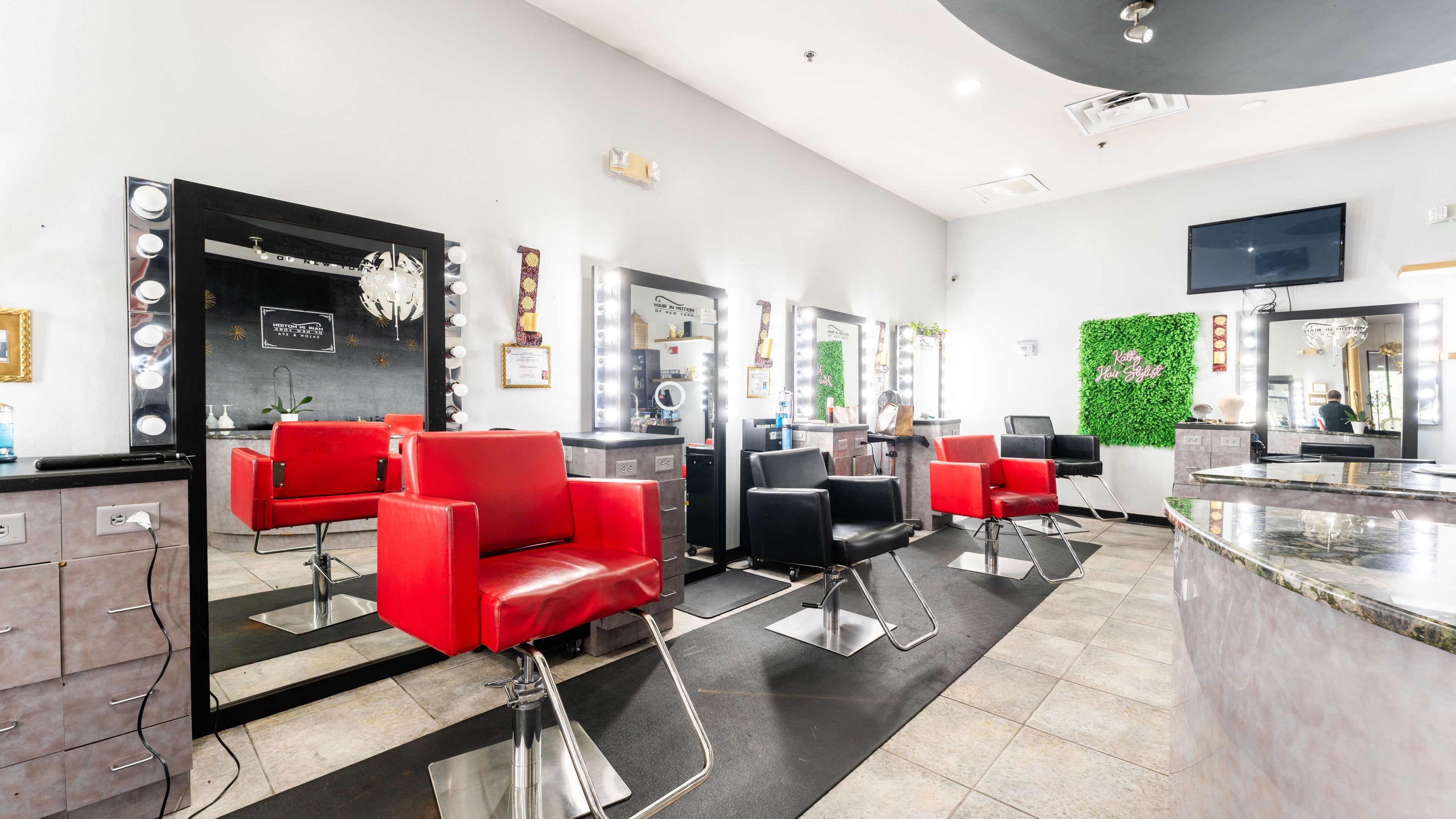 Modern salon interior at Hair in Motion of New York - MetroWest, Orlando, Florida, US with stylish decor.