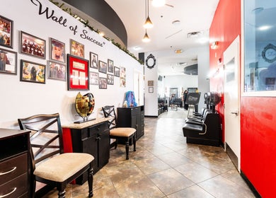 Hair in Motion of New York - MetroWest in Orlando, Florida, US. Interior view with wall of success and stylish chairs.