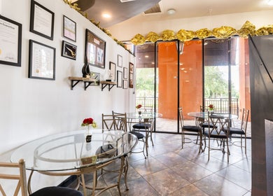 Modern interior of Hair in Motion of New York - MetroWest, Orlando, Florida, US with elegant decor and seating.