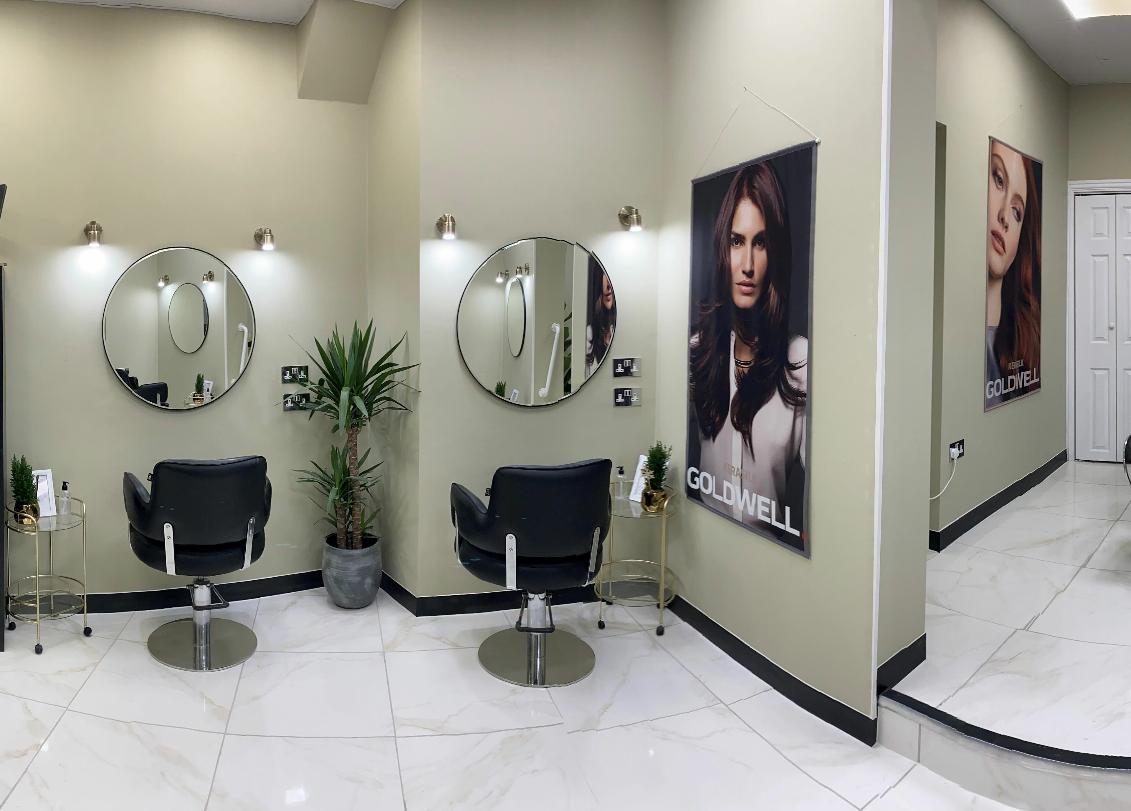 Elegant salon interior at Shear Desire, Shepshed, England, GB featuring modern decor and styling chairs.