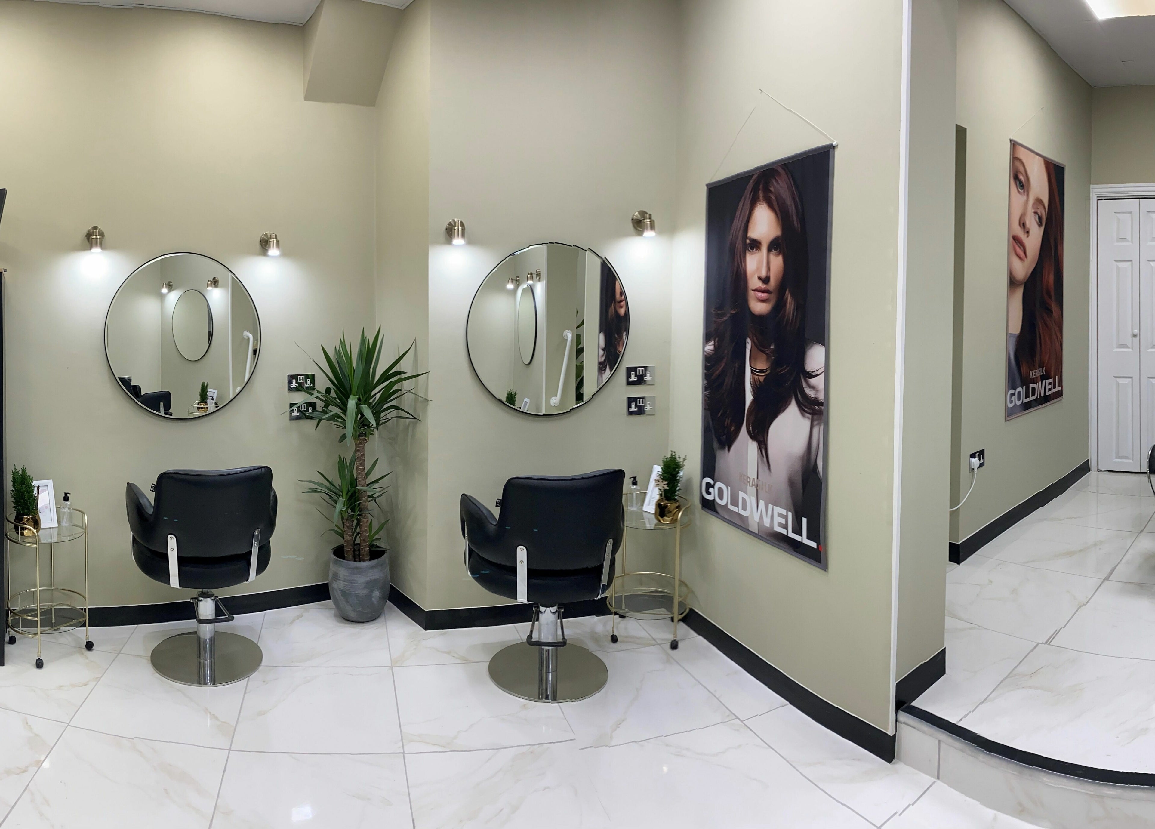 Elegant salon interior at Shear Desire, Shepshed, England, GB featuring modern decor and styling chairs.
