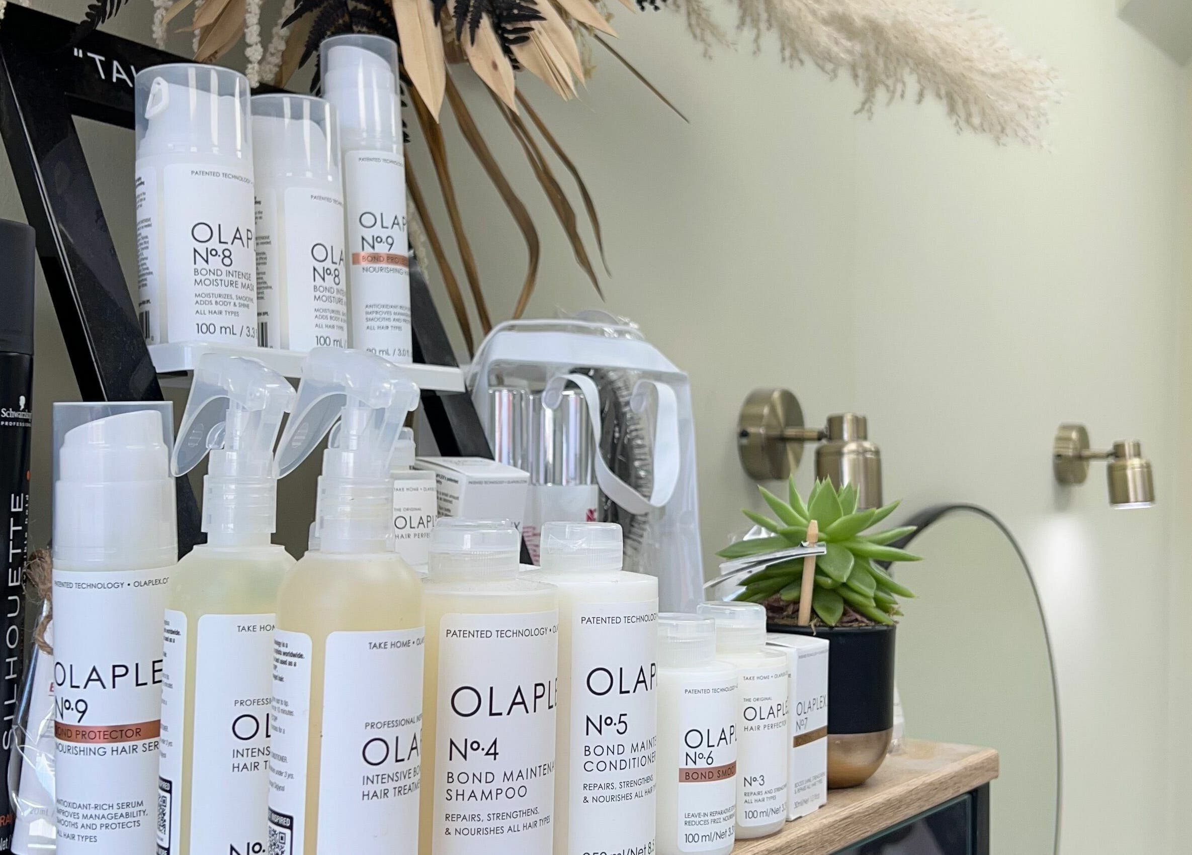 Hair care products on display at Shear Desire, Shepshed, England, GB, offering premium beauty treatments.