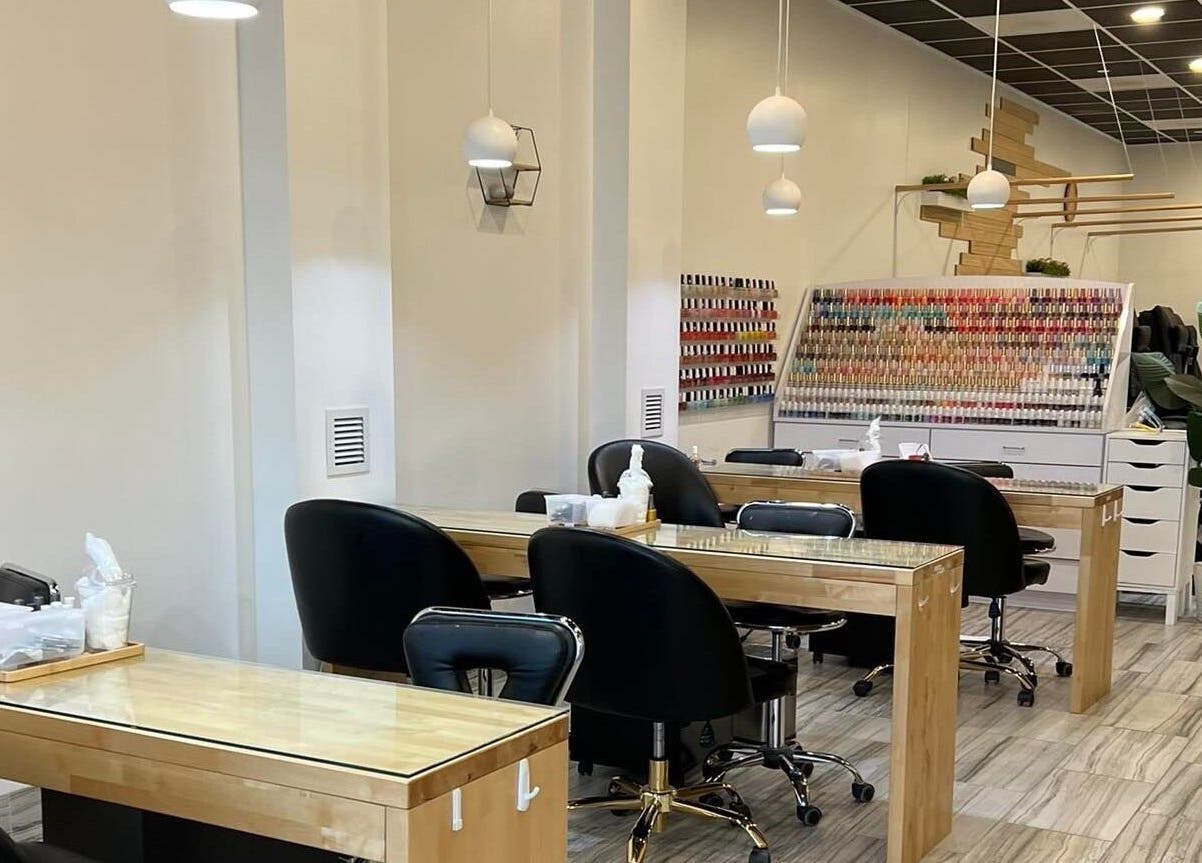 Interior of ANGELISH NAIL SALON in Lake Elmo, Minnesota, US showcasing modern nail stations and vibrant polish selection.