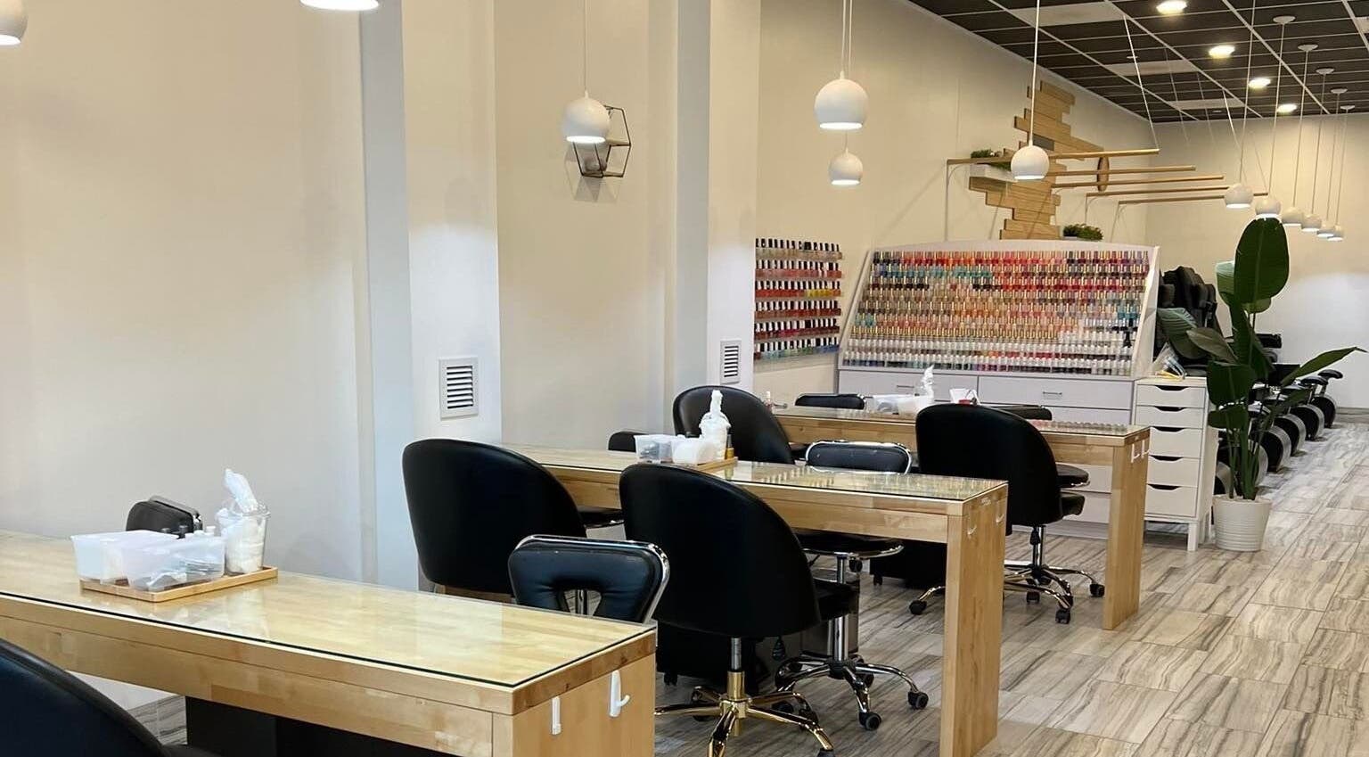 Interior of ANGELISH NAIL SALON in Lake Elmo, Minnesota, US showcasing modern nail stations and vibrant polish selection.