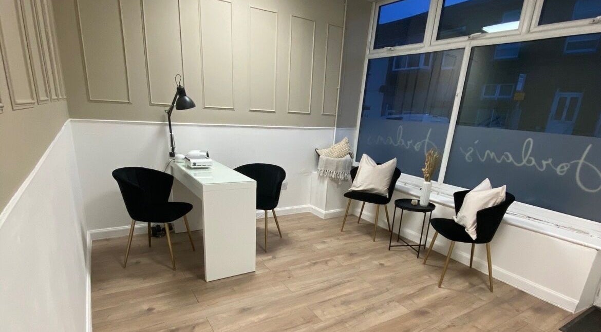 Elegant seating area at Jordan's Beauty Room, Ferndale, Wales, GB with cozy decor and modern design.