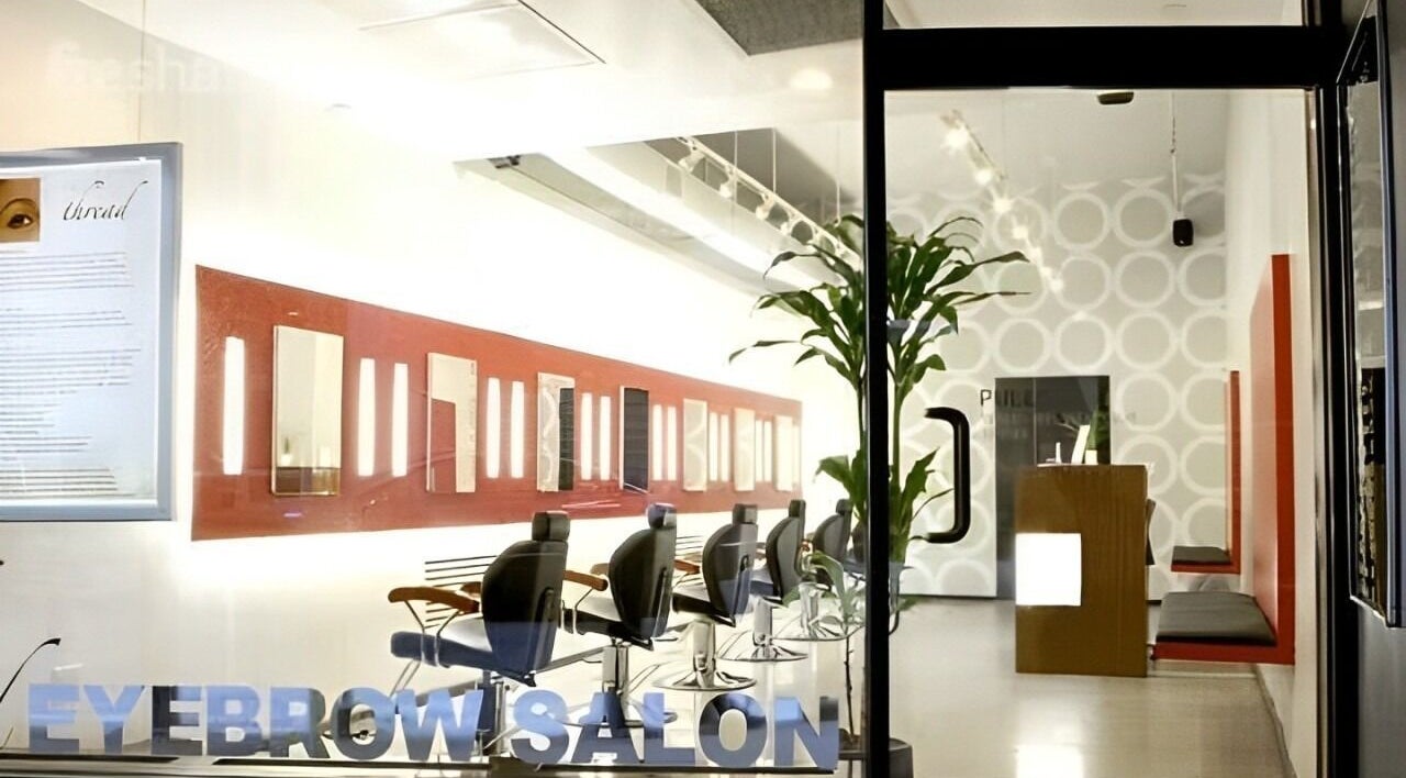 Stylish interior of Thread - Financial District, showcasing mirrors and chairs, New York, New York, US.