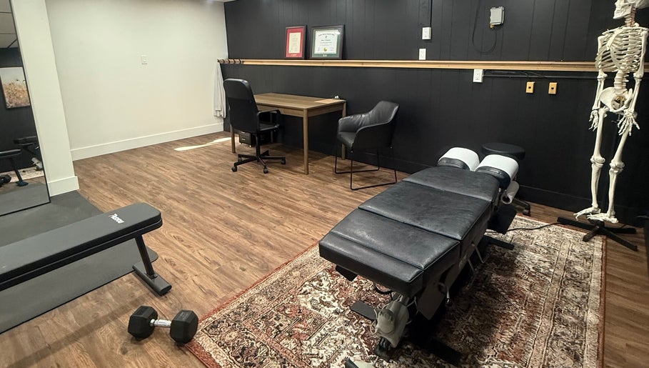 Cozy therapy room at Beauty Basics by Amy, Minden, Ontario, CA, featuring massage table and decor.