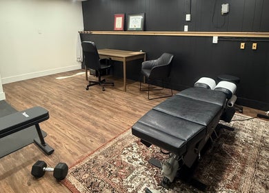 Cozy therapy room at Beauty Basics by Amy, Minden, Ontario, CA, featuring massage table and decor.