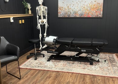 Modern wellness room at Beauty Basics by Amy, Minden, Ontario, CA, featuring a treatment table and decor.