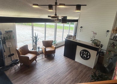Inviting reception at Beauty Basics by Amy, Minden, Ontario, CA with cozy chairs and modern decor.