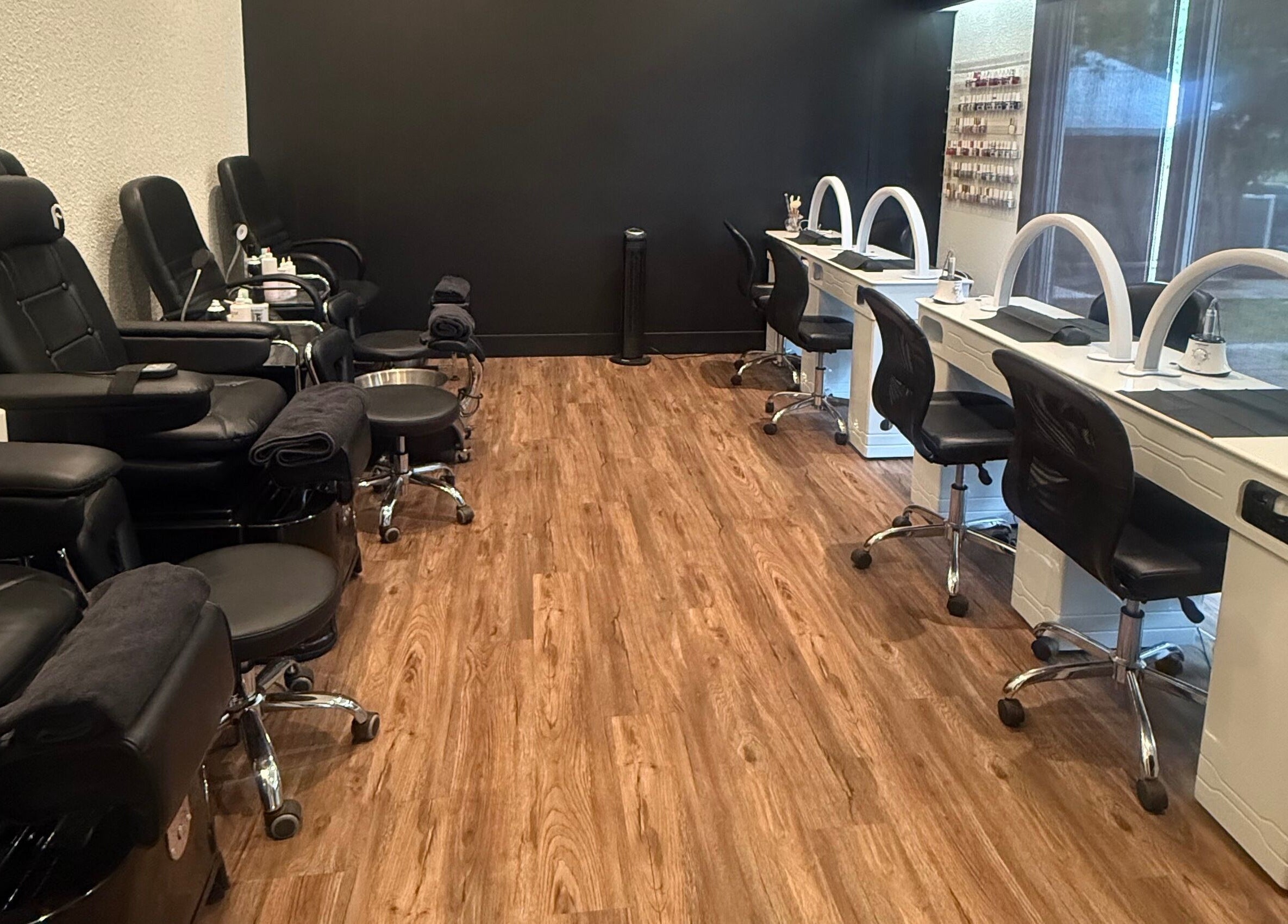 Spacious beauty and nail salon at Beauty Basics by Amy, Minden, Ontario, CA, with modern black and white decor.