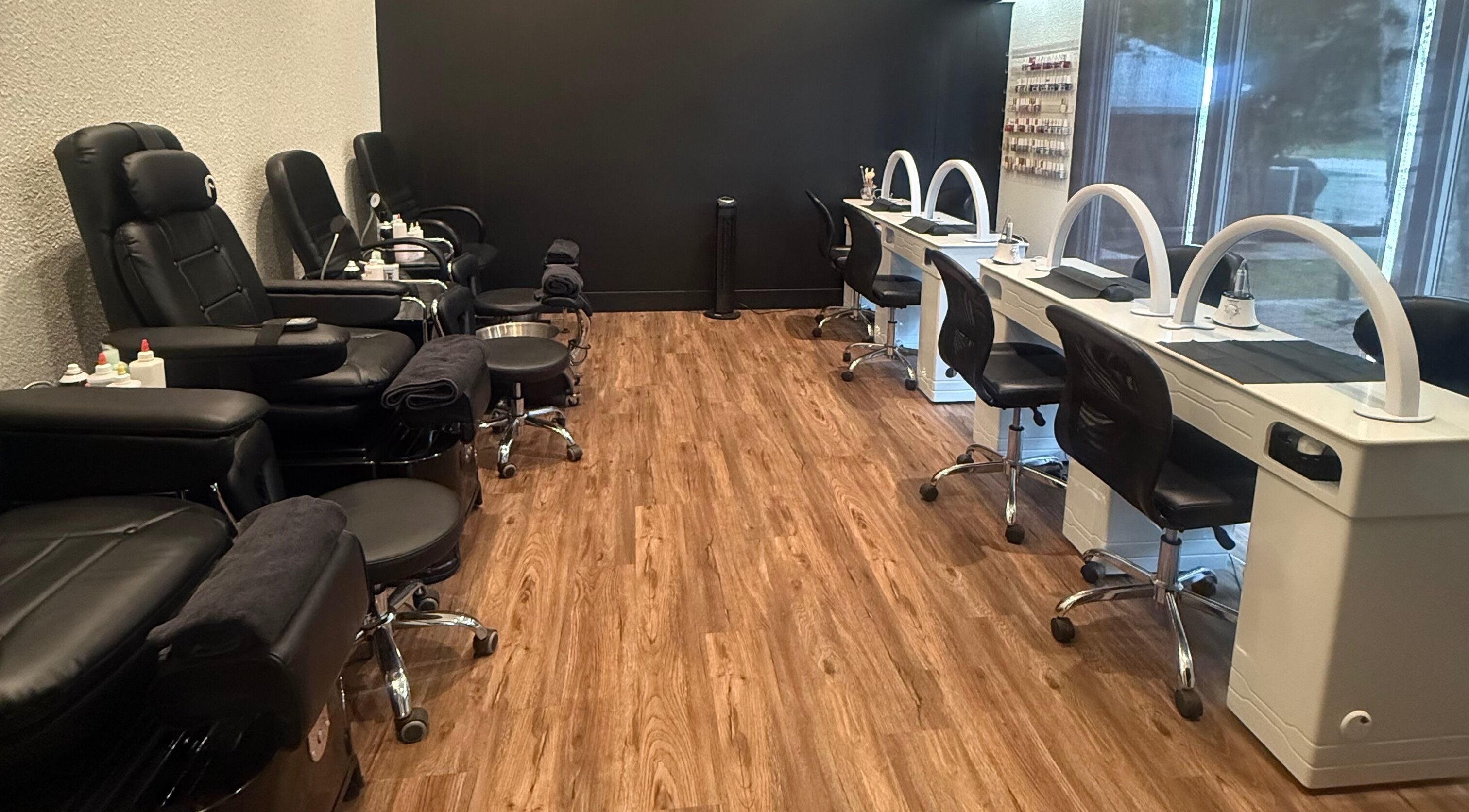 Spacious beauty and nail salon at Beauty Basics by Amy, Minden, Ontario, CA, with modern black and white decor.