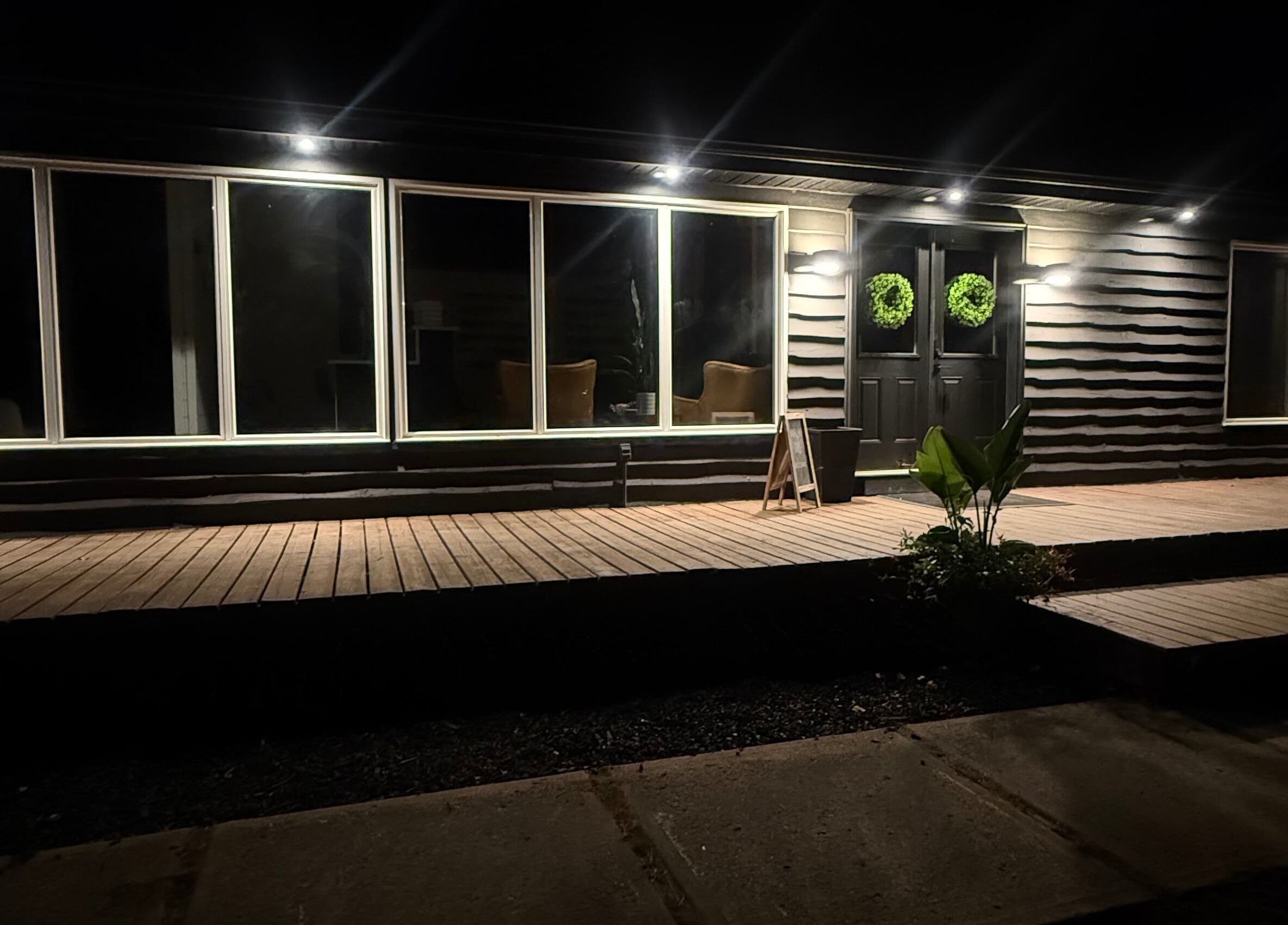 Night view of Beauty Basics by Amy, Minden, Ontario, CA showcasing elegant exterior lighting.
