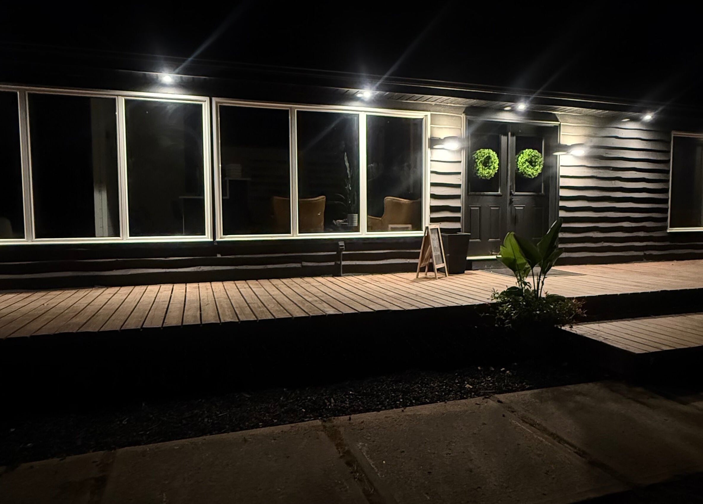 Night view of Beauty Basics by Amy, Minden, Ontario, CA showcasing elegant exterior lighting.