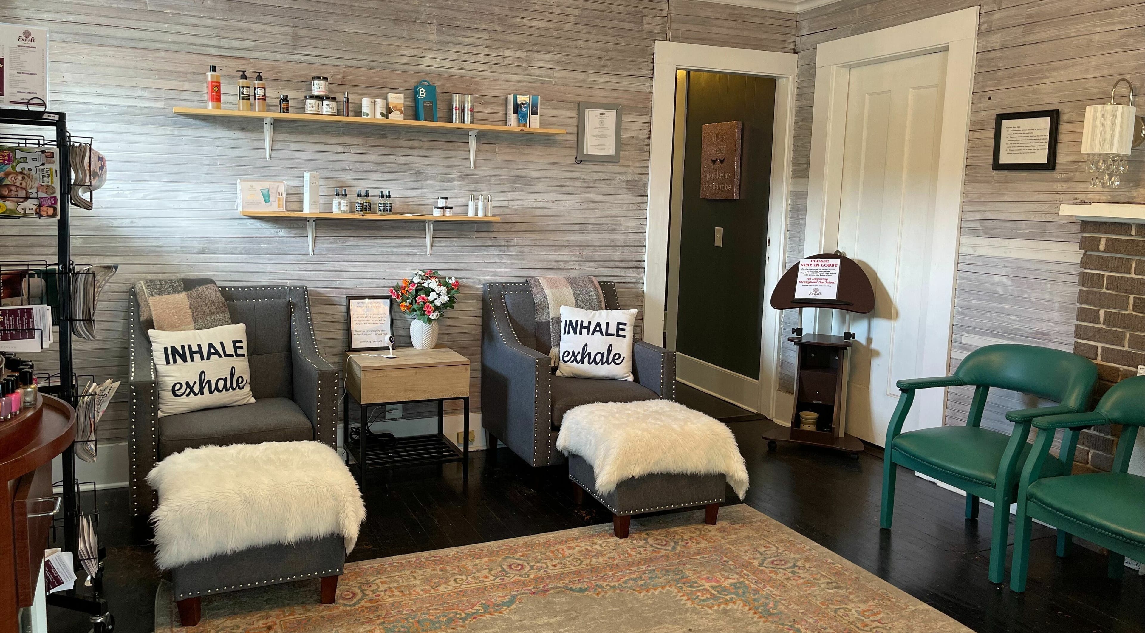 Cozy seating area at Exhale Day Spa, Thomasville, Georgia, featuring plush chairs and calming decor.