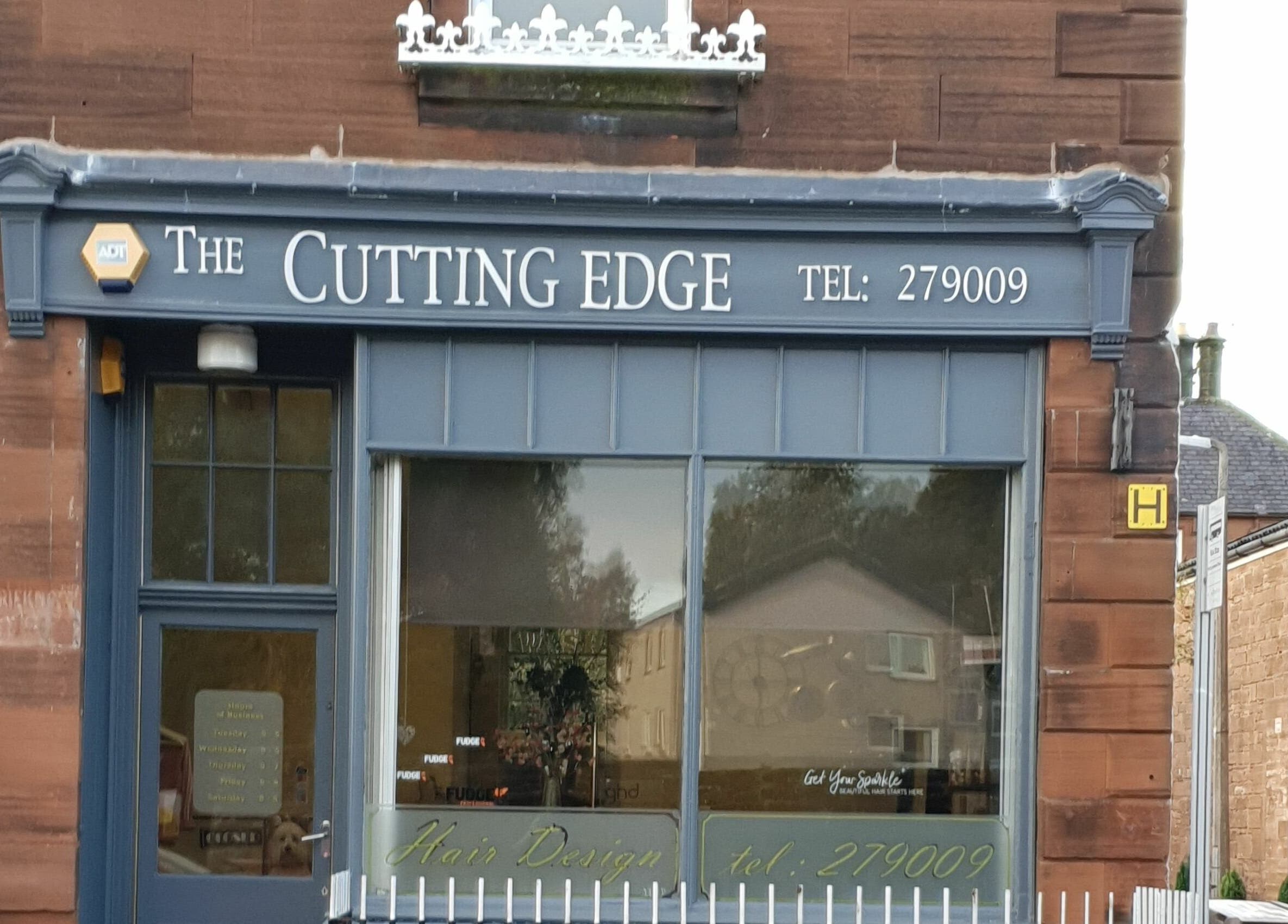 The Cutting Edge salon exterior in Dumfries, Scotland, GB shows stylish signage and inviting entrance.