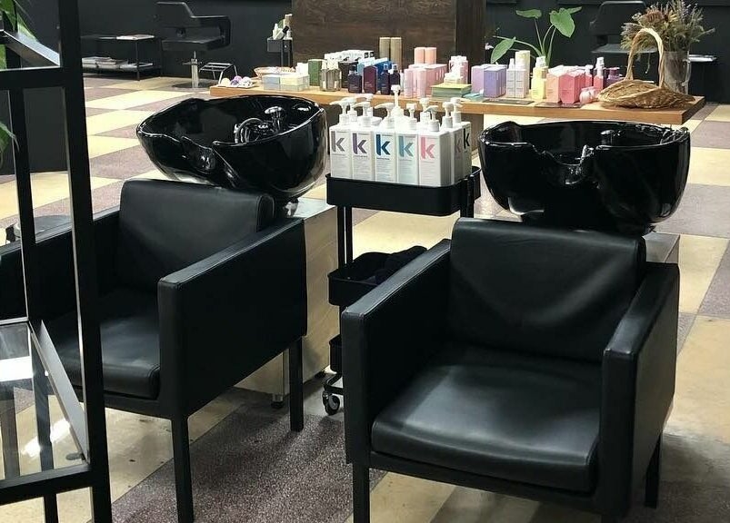Modern salon chairs and hair wash stations at Hairs on Fire, Fremantle, Western Australia, AU.