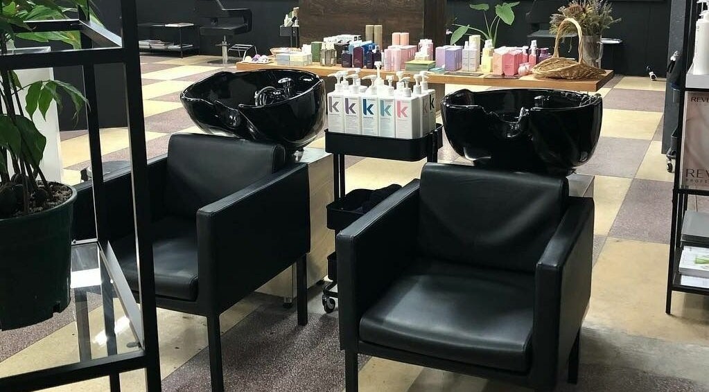 Modern salon chairs and hair wash stations at Hairs on Fire, Fremantle, Western Australia, AU.