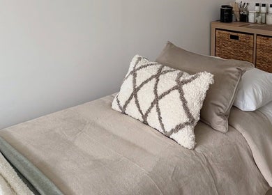 Luxurious treatment room at Sarah Lawson Beauty, Dalkeith, Scotland, GB. Plush pillows and soft linens.