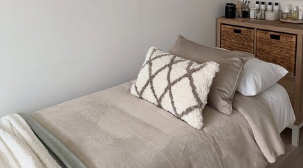 Luxurious treatment room at Sarah Lawson Beauty, Dalkeith, Scotland, GB. Plush pillows and soft linens.