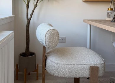 Elegant chair and plant at Sarah Lawson Beauty, Dalkeith, Scotland, GB enhancing a serene salon ambiance.