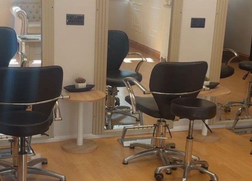 Modern hairstyling chairs at Beautevas Beauty and Tanning, Martlesham, England, GB enhancing client comfort.