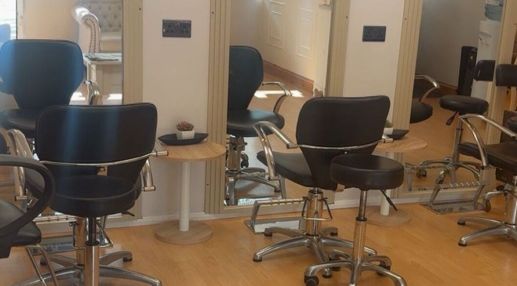 Modern hairstyling chairs at Beautevas Beauty and Tanning, Martlesham, England, GB enhancing client comfort.